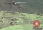 Image of 155mm howitzer slung beneath a CH-54 helicopter Vietnam, 1969, second 46 stock footage video 65675023785