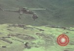 Image of 155mm howitzer slung beneath a CH-54 helicopter Vietnam, 1969, second 47 stock footage video 65675023785
