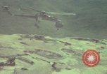 Image of 155mm howitzer slung beneath a CH-54 helicopter Vietnam, 1969, second 48 stock footage video 65675023785