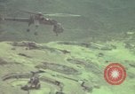 Image of 155mm howitzer slung beneath a CH-54 helicopter Vietnam, 1969, second 51 stock footage video 65675023785