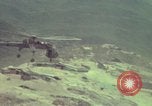 Image of 155mm howitzer slung beneath a CH-54 helicopter Vietnam, 1969, second 54 stock footage video 65675023785