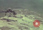 Image of 155mm howitzer slung beneath a CH-54 helicopter Vietnam, 1969, second 55 stock footage video 65675023785