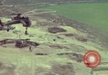 Image of 155mm howitzer slung beneath a CH-54 helicopter Vietnam, 1969, second 60 stock footage video 65675023785