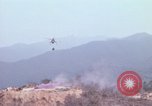 Image of CH-54 delivers a howitzer to Fire Support Base Whip Vietnam, 1969, second 11 stock footage video 65675023786