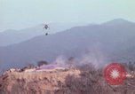 Image of CH-54 delivers a howitzer to Fire Support Base Whip Vietnam, 1969, second 12 stock footage video 65675023786