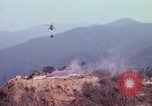 Image of CH-54 delivers a howitzer to Fire Support Base Whip Vietnam, 1969, second 13 stock footage video 65675023786