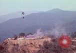 Image of CH-54 delivers a howitzer to Fire Support Base Whip Vietnam, 1969, second 14 stock footage video 65675023786