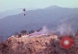 Image of CH-54 delivers a howitzer to Fire Support Base Whip Vietnam, 1969, second 15 stock footage video 65675023786