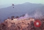 Image of CH-54 delivers a howitzer to Fire Support Base Whip Vietnam, 1969, second 16 stock footage video 65675023786
