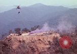 Image of CH-54 delivers a howitzer to Fire Support Base Whip Vietnam, 1969, second 17 stock footage video 65675023786