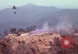 Image of CH-54 delivers a howitzer to Fire Support Base Whip Vietnam, 1969, second 18 stock footage video 65675023786