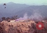 Image of CH-54 delivers a howitzer to Fire Support Base Whip Vietnam, 1969, second 19 stock footage video 65675023786