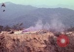 Image of CH-54 delivers a howitzer to Fire Support Base Whip Vietnam, 1969, second 20 stock footage video 65675023786