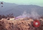 Image of CH-54 delivers a howitzer to Fire Support Base Whip Vietnam, 1969, second 21 stock footage video 65675023786
