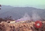 Image of CH-54 delivers a howitzer to Fire Support Base Whip Vietnam, 1969, second 22 stock footage video 65675023786