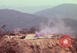 Image of CH-54 delivers a howitzer to Fire Support Base Whip Vietnam, 1969, second 27 stock footage video 65675023786