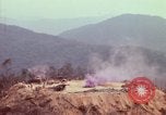 Image of CH-54 delivers a howitzer to Fire Support Base Whip Vietnam, 1969, second 28 stock footage video 65675023786
