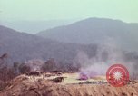 Image of CH-54 delivers a howitzer to Fire Support Base Whip Vietnam, 1969, second 29 stock footage video 65675023786