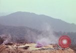 Image of CH-54 delivers a howitzer to Fire Support Base Whip Vietnam, 1969, second 31 stock footage video 65675023786