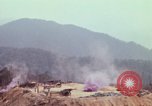 Image of CH-54 delivers a howitzer to Fire Support Base Whip Vietnam, 1969, second 32 stock footage video 65675023786