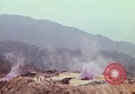 Image of CH-54 delivers a howitzer to Fire Support Base Whip Vietnam, 1969, second 33 stock footage video 65675023786