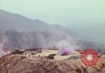 Image of CH-54 delivers a howitzer to Fire Support Base Whip Vietnam, 1969, second 35 stock footage video 65675023786