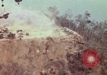 Image of CH-54 delivers a howitzer to Fire Support Base Whip Vietnam, 1969, second 39 stock footage video 65675023786