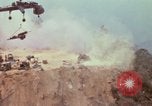 Image of CH-54 delivers a howitzer to Fire Support Base Whip Vietnam, 1969, second 42 stock footage video 65675023786