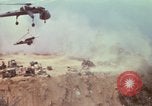 Image of CH-54 delivers a howitzer to Fire Support Base Whip Vietnam, 1969, second 43 stock footage video 65675023786
