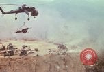 Image of CH-54 delivers a howitzer to Fire Support Base Whip Vietnam, 1969, second 44 stock footage video 65675023786