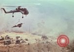 Image of CH-54 delivers a howitzer to Fire Support Base Whip Vietnam, 1969, second 45 stock footage video 65675023786