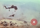 Image of CH-54 delivers a howitzer to Fire Support Base Whip Vietnam, 1969, second 46 stock footage video 65675023786