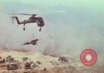 Image of CH-54 delivers a howitzer to Fire Support Base Whip Vietnam, 1969, second 47 stock footage video 65675023786