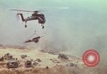 Image of CH-54 delivers a howitzer to Fire Support Base Whip Vietnam, 1969, second 48 stock footage video 65675023786