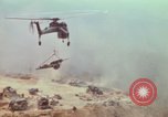 Image of CH-54 delivers a howitzer to Fire Support Base Whip Vietnam, 1969, second 49 stock footage video 65675023786