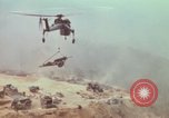 Image of CH-54 delivers a howitzer to Fire Support Base Whip Vietnam, 1969, second 50 stock footage video 65675023786