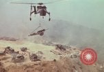 Image of CH-54 delivers a howitzer to Fire Support Base Whip Vietnam, 1969, second 51 stock footage video 65675023786