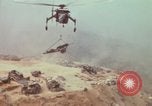 Image of CH-54 delivers a howitzer to Fire Support Base Whip Vietnam, 1969, second 52 stock footage video 65675023786