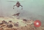Image of CH-54 delivers a howitzer to Fire Support Base Whip Vietnam, 1969, second 53 stock footage video 65675023786