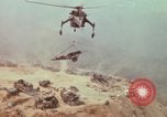 Image of CH-54 delivers a howitzer to Fire Support Base Whip Vietnam, 1969, second 54 stock footage video 65675023786