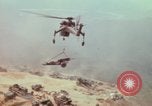 Image of CH-54 delivers a howitzer to Fire Support Base Whip Vietnam, 1969, second 55 stock footage video 65675023786