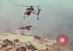 Image of CH-54 delivers a howitzer to Fire Support Base Whip Vietnam, 1969, second 56 stock footage video 65675023786