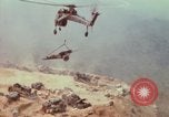 Image of CH-54 delivers a howitzer to Fire Support Base Whip Vietnam, 1969, second 57 stock footage video 65675023786