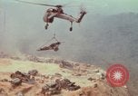 Image of CH-54 delivers a howitzer to Fire Support Base Whip Vietnam, 1969, second 58 stock footage video 65675023786