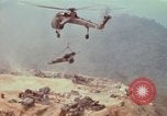 Image of CH-54 delivers a howitzer to Fire Support Base Whip Vietnam, 1969, second 59 stock footage video 65675023786