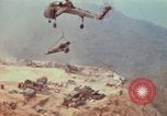 Image of CH-54 delivers a howitzer to Fire Support Base Whip Vietnam, 1969, second 60 stock footage video 65675023786