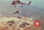 Image of CH-54 delivers a howitzer to Fire Support Base Whip Vietnam, 1969, second 61 stock footage video 65675023786