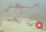 Image of CH-54 delivers a howitzer to Fire Support Base Whip Vietnam, 1969, second 62 stock footage video 65675023786