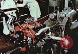 Immagine di Valutare l'usura del motore con parti irradiate Detroit Michigan USA, 1957, secondo 51 filmato di repertorio 65675023831