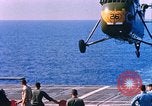 Standbild US Marine Corps UH 34D Hubschrauber landet auf Deck Cape Canaveral Florida USA, 1962, aus Sekunde 21 historischem Filmmaterial Videoclip 65675024593